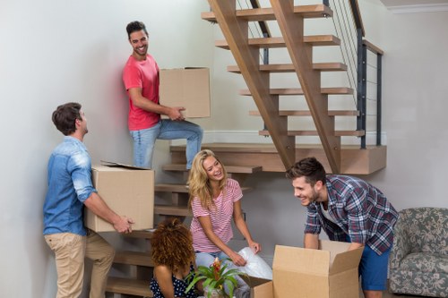 Professional flat removals in Haggerston with packed boxes ready for transport
