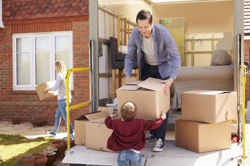 Moving van and packed boxes for house removals in Haggerston
