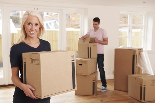Removal team preparing furniture for transport
