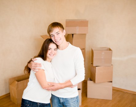 Labelled boxes and shelving inside a neat self storage unit