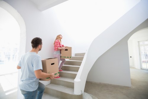 Movers carrying furniture during a local move in Haggerston